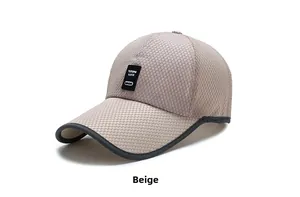 Detail of beige mesh baseball cap featuring a black leather logo patch and breathable fabric