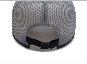 Detail view of the breathable grey mesh fabric and adjustable black strap buckle on the cap
