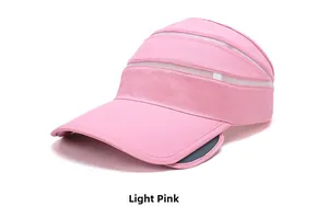 Detail of light pink sun visor featuring breathable mesh and retractable side wings