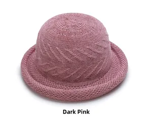 Close-up of a dark pink woven dome hat featuring breathable textures and a rolled brim
