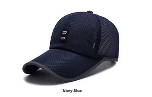 Detail of navy blue mesh baseball cap with breathable honeycomb fabric and woven patch