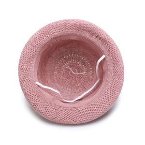 Pink hollow woven dome sun hat for women featuring a secure white elastic windproof strap