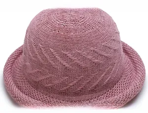 Detailed macro view showing the pink knitted crochet texture and precise stitching pattern