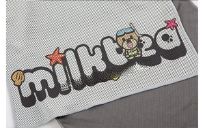 Detail shot of breathable mesh fabric on cooling towel with cartoon ocean patterns