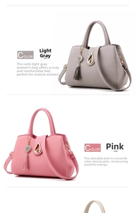 Detail of light gray and pink litchi pattern tote bags with tassel and metal charms
