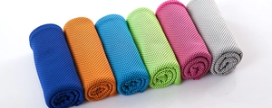 Macro detail of breathable mesh fabric on assorted quick-dry cooling sports towels