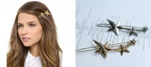 Detail view of star-shaped metal hair clips in gold and silver finish for women