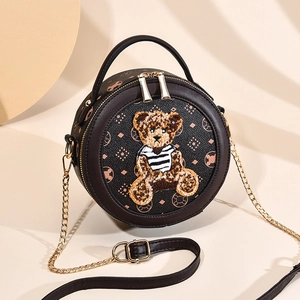 Sac à bandoulière rond en cuir marron vintage avec patch ours en peluche et chaîne