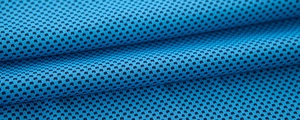 Macro shot of breathable blue mesh fabric with high-density honeycomb cooling structure