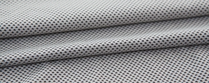Close-up of gray and white cooling towel with breathable honeycomb mesh fabric