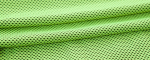 Macro detail of breathable green honeycomb mesh fabric for cooling sports towel