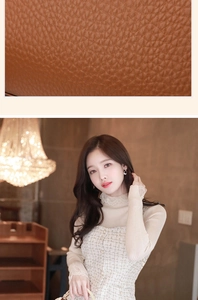 Close-up of brown lychee grain leather texture on a stylish women crossbody bag