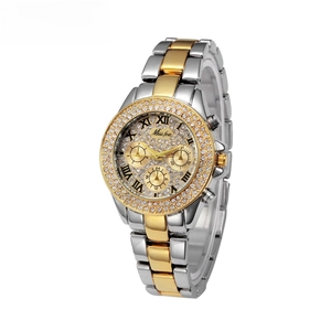 Detailed close-up of Miss Fox watch featuring rhinestone bezel and two-tone metal strap