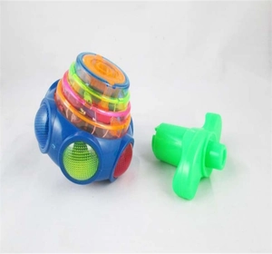 Colorful light-up spinning top toy with green launcher and glowing LED features
