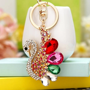 Detail of crystal swan keychain with colorful rhinestones and golden alloy ring