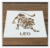 Detail view of a Leo zodiac stencil tool on wooden surface for coffee and milk tea foam art