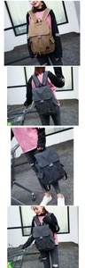Detail des Canvas-Rucksacks mit Seitentaschen und verstellbaren breiten Schultergurten