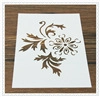 Detail of vintage flower hollow stencil for coffee decorating on a wooden table