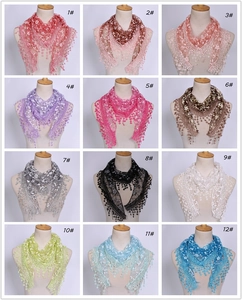 Detailed view of lace triangle scarves in 12 colors with floral embroidery and tassels