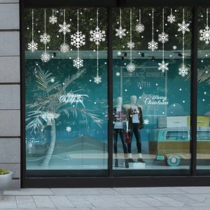 White snowflake window decals with Merry Christmas lettering for holiday glass decoration