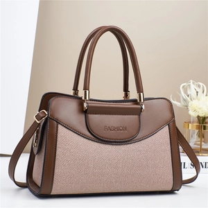Sac à main bandoulière chic en toile bicolore et cuir marron avec logo embossé