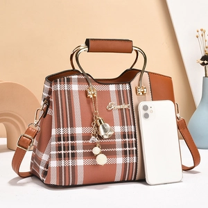 Classic brown plaid handbag with golden metal handles and pearl tassel charm accessories