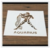 Detailed macro view of an Aquarius stencil for coffee art on a rustic wood surface