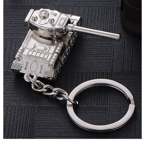 Close-up of a silver alloy T34 tank keychain with detailed turret and metallic finish
