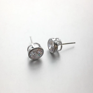 Macro view of 925 sterling silver stud earrings with large clear cubic zirconia stones