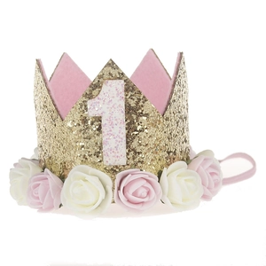 Detail of baby first birthday crown with gold sequins, pink number 1 and faux flowers