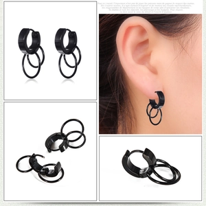 Detail view of black titanium steel double hoop earrings in trendy punk style