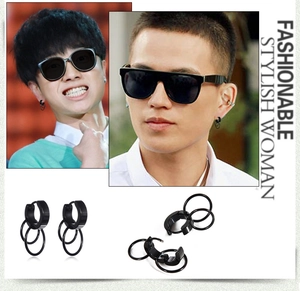 Detail of black titanium steel double ring hoop earrings for a punk hip-hop look