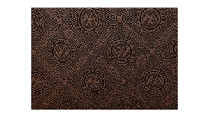 Macro shot of dark brown leather texture with embossed Ounla logo and geometric patterns