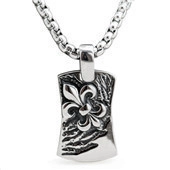 Detail view of silver necklace featuring a fleur-de-lis embossed rectangular pendant