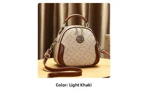Close-up of monogram pattern and gold logo detail on the khaki crossbody bag