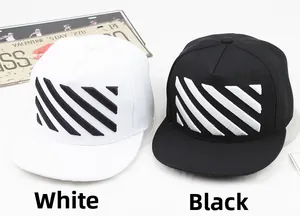 Detail of diagonal stripe 3D embroidery on black and white cotton snapback hats
