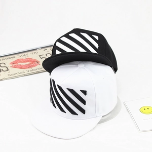 Detail of diagonal stripe embroidery on black and white flat brim snapback hats