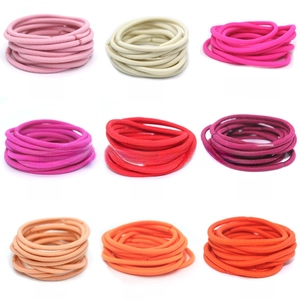 Macro shot of 3mm high elasticity seamless hair ties in various vibrant candy colors