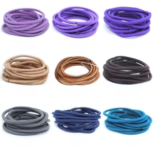 Detail showing 3mm high-elastic seamless hair ties in nine assorted candy colors