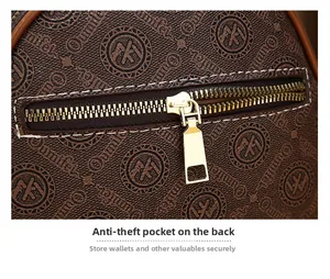 Detail of the anti-theft zipper pocket on a brown monogram patterned crossbody bag