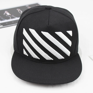 Detailed embroidery of white diagonal stripes on a flat-brim black streetwear snapback cap