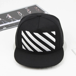 Detail of white diagonal stripe embroidery on a black flat-brim hip-hop style snapback cap