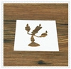 Detailed stencil of Lumiere character for Christmas coffee art on dark wood surface