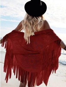 Bohemian wine red fringe shawl with hollow patterns shown on a beach background