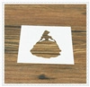 Detailed overhead shot of a white plastic coffee stencil with a princess silhouette design