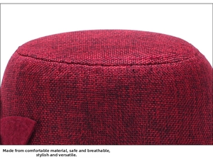 Macro shot of red and black woven breathable linen texture on a women sun hat