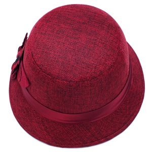 Deep red linen sun hat for women featuring a large floral accent and satin ribbon