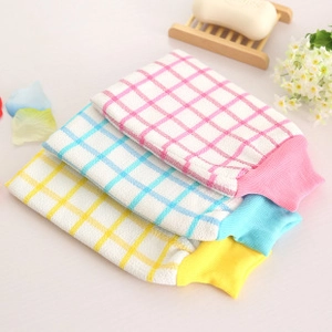 Detailed view of pink, blue, and yellow plaid nylon back scrubbers for body exfoliation