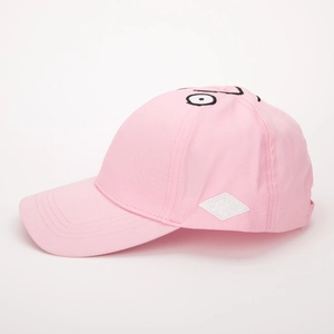 Detail of pink cotton baseball cap with cartoon eye embroidery and side woven patch