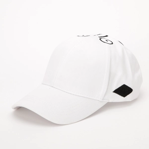 Detail view of white cotton baseball cap with black line art face embroidery